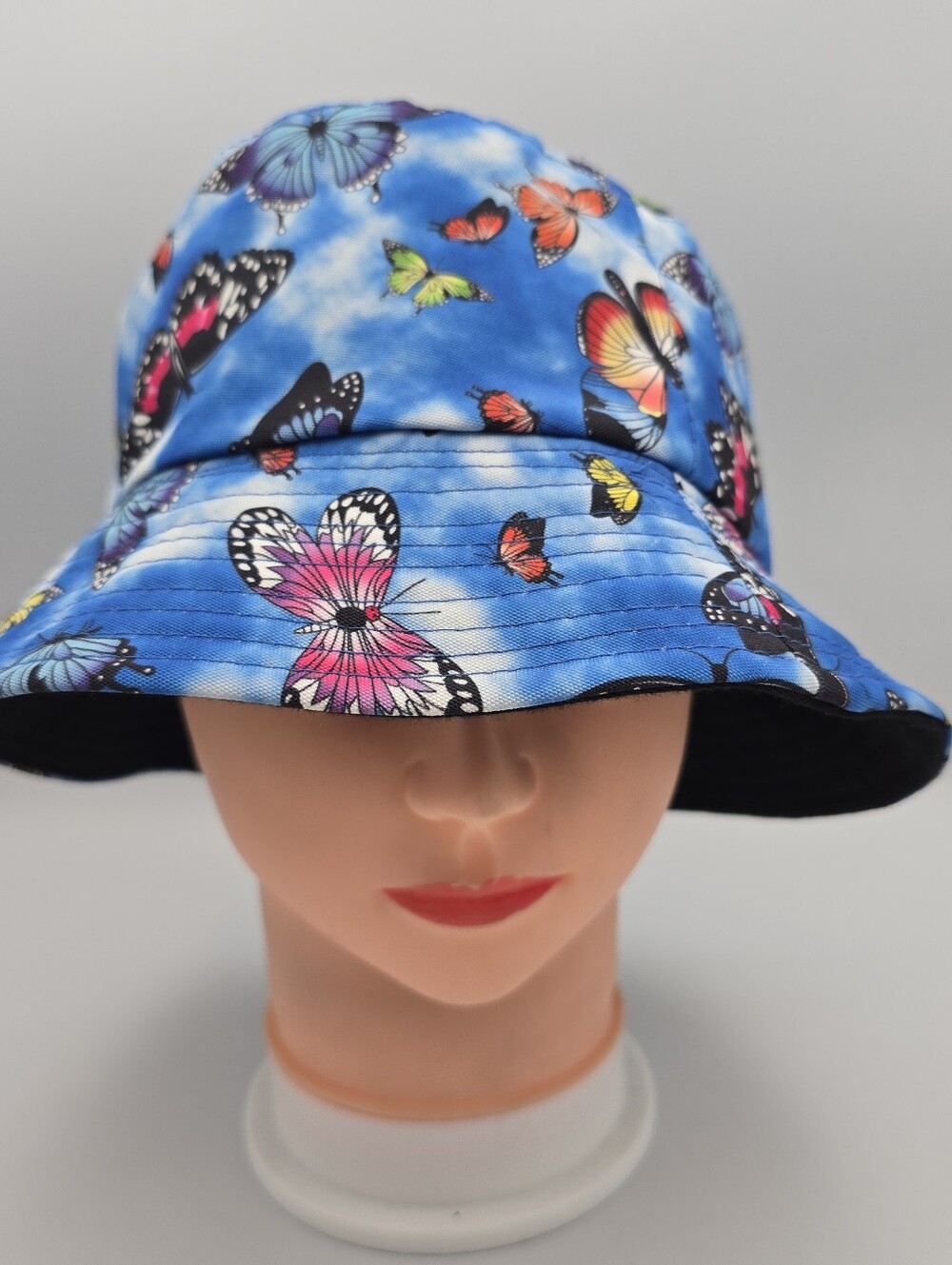 Unbranded Reversible Blue Butterfly Print/Black Solid Bucket Hat